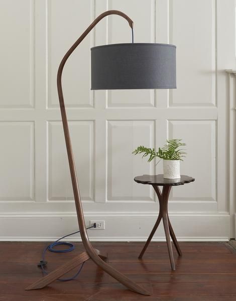 Tall curved floor lamp made from wood