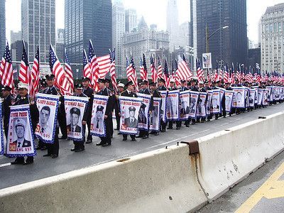 NYC Firefighter Run - Amanda and Ryan Nemec #groundzeronyc Ground Zero, NYC - post-9/11/01 - the flags & pictures are of the 343 firefighters who gave their lives so others could live on that terrible day. #groundzeronyc