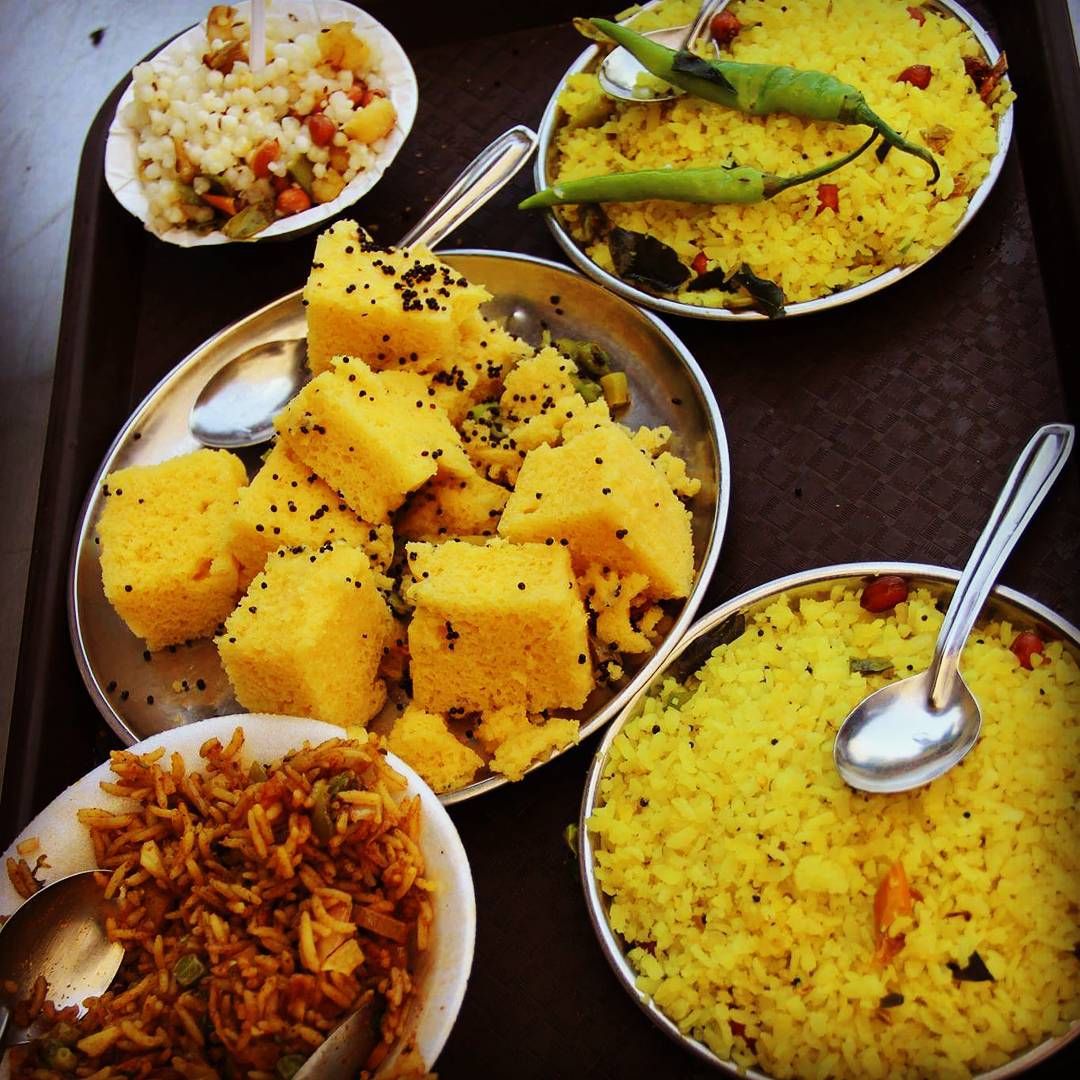 As we were descending from the pious pilgrimage Pavagarh, we made a leisurely stop for sumptuous Gujarati lunch. Just what we needed after a tiring morning! In picture, Dhokla, Sabudana Khichdi , Poha , Pulao. The view from my #SoulWindow is Saaru Che ! #Traveladdu #RollingLaddu #SinghOnWing #lonelyplanetindia #NatGeo #IncredibleIndia #India #Backpacking #BudgetTravel #EveryonecanTravel #Travel #SoloTravel #Hindu #TravelBlog #Wanderer #Gujarat #travelgram #tourist #igtravel #instagood #picofth Sabudana Khichdi, Dhokla, Pulao, Pilgrimage, Solo Travel, Backpacking, Tourist, Curry, Instagood