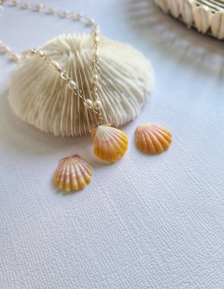 Sunrise Seashell Necklace Material: Sunrise Seashell 14K Gold Filled Wired Freshwater Pearl Packed ready for gift giving Every Jewelry is design and made by me at my home in Lahaina, Hawaii. I make one jewelry at a time and every style are mindfully hand-crafted at the moment. Mahalo for your support! Seashell Necklace, Shell Necklaces, Pearl Necklace, New Years Eve Outfits, 14k Gold Filled, Handcrafted Jewelry, Sea Shells, Hawaiian, Sunrise