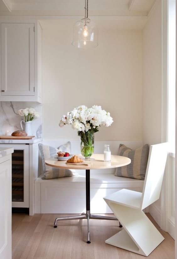 A Tiny Breakfast Nook With Built In Bench Round Table And Geometric Chair Banquette Seating Kitchen Banquette Seating In Kitchen, Small Round Kitchen Nook Table