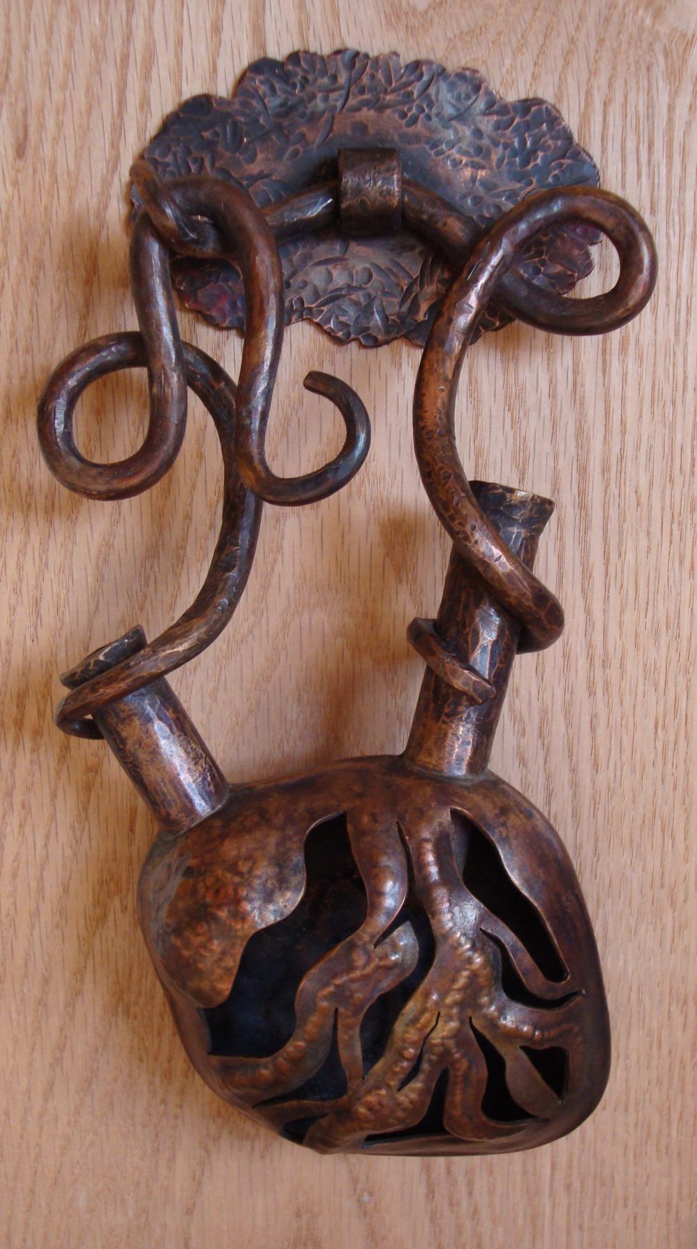 Really cool copper heart door knocker