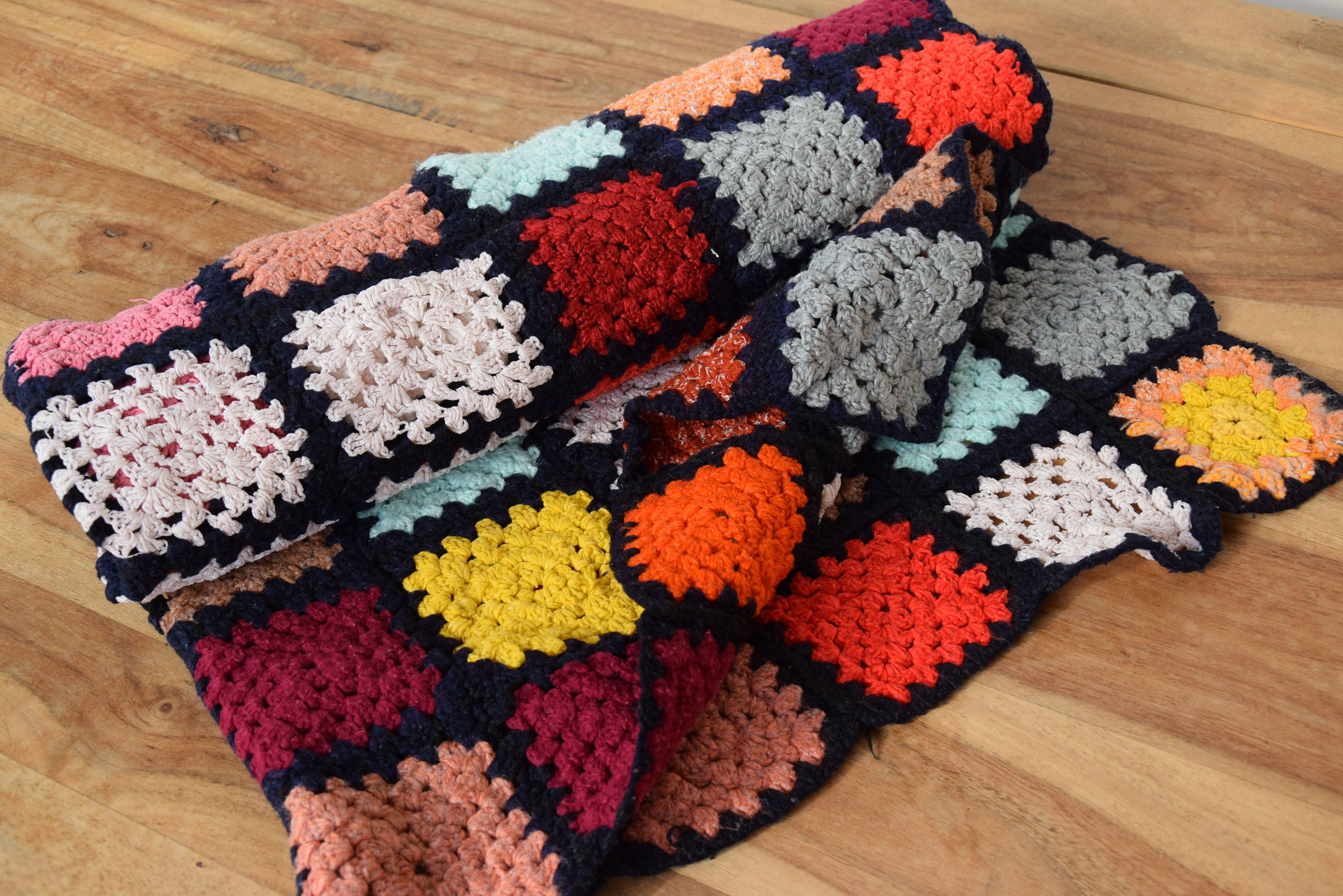 Handmade multi coloured patchwork crocheted baby blanket