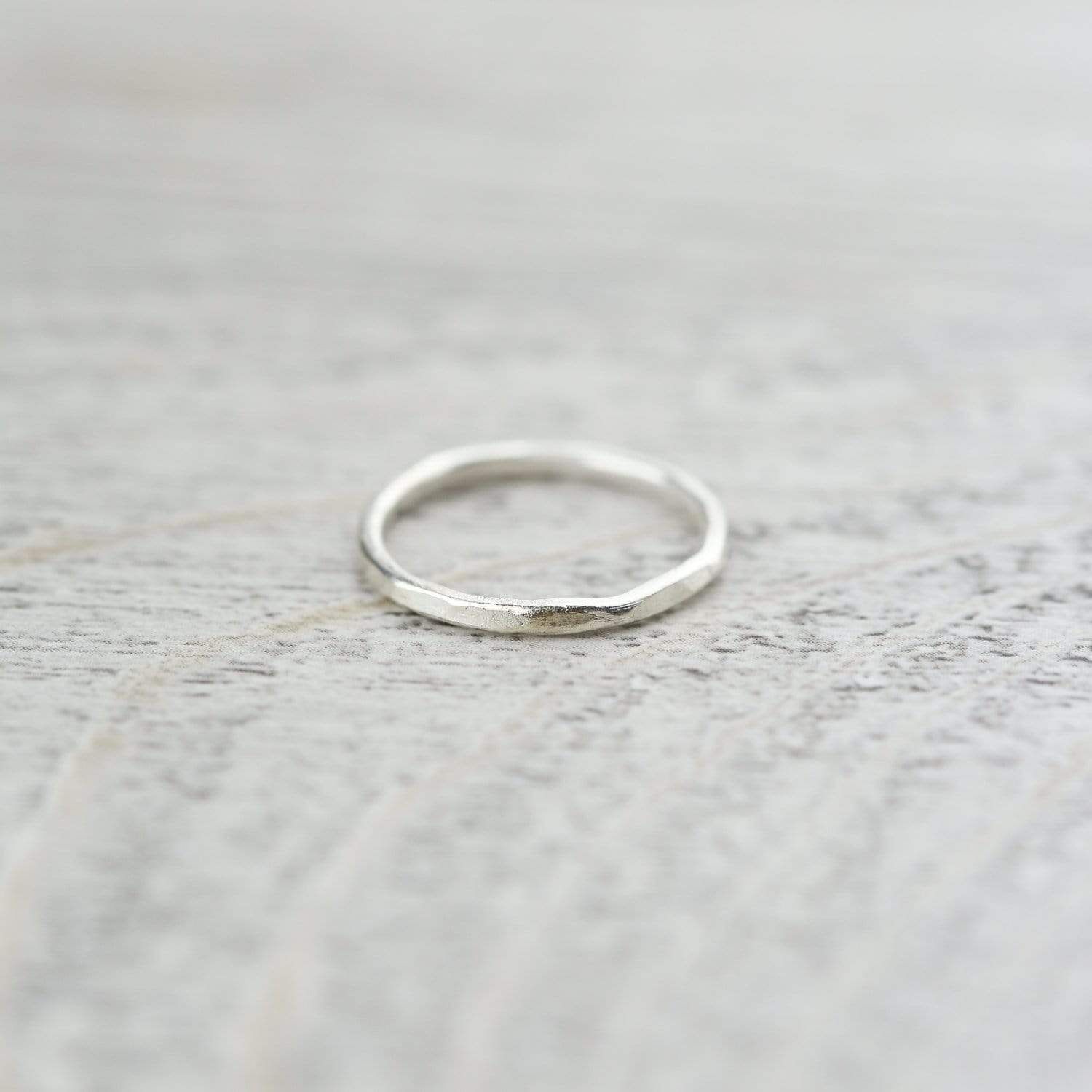 This stylish, hand hammered ring is made entirely with (.98) Hill Tribe silver. These handcrafted rings from Thailand are perfect for everyday wear. Wear it alone or combine a few to create a stylish stacked look. Made by the Karen Hill Tribe silversmiths in Northern Thailand. Hill Tribe silver has a higher than .925 silver content and displays a radiant shine that rarely needs to be polished. These simple handmade rings go great with anything! Sized ring - sold individually. Rings are about 2mm Delicate Silver Rings, Sterling Silver Rings Simple, Simple Silver Jewelry, Hammered Silver Ring, Silver Ring Set, Silver Jewelry Rings, Anklet Jewelry, 925 Silver, Jewellery