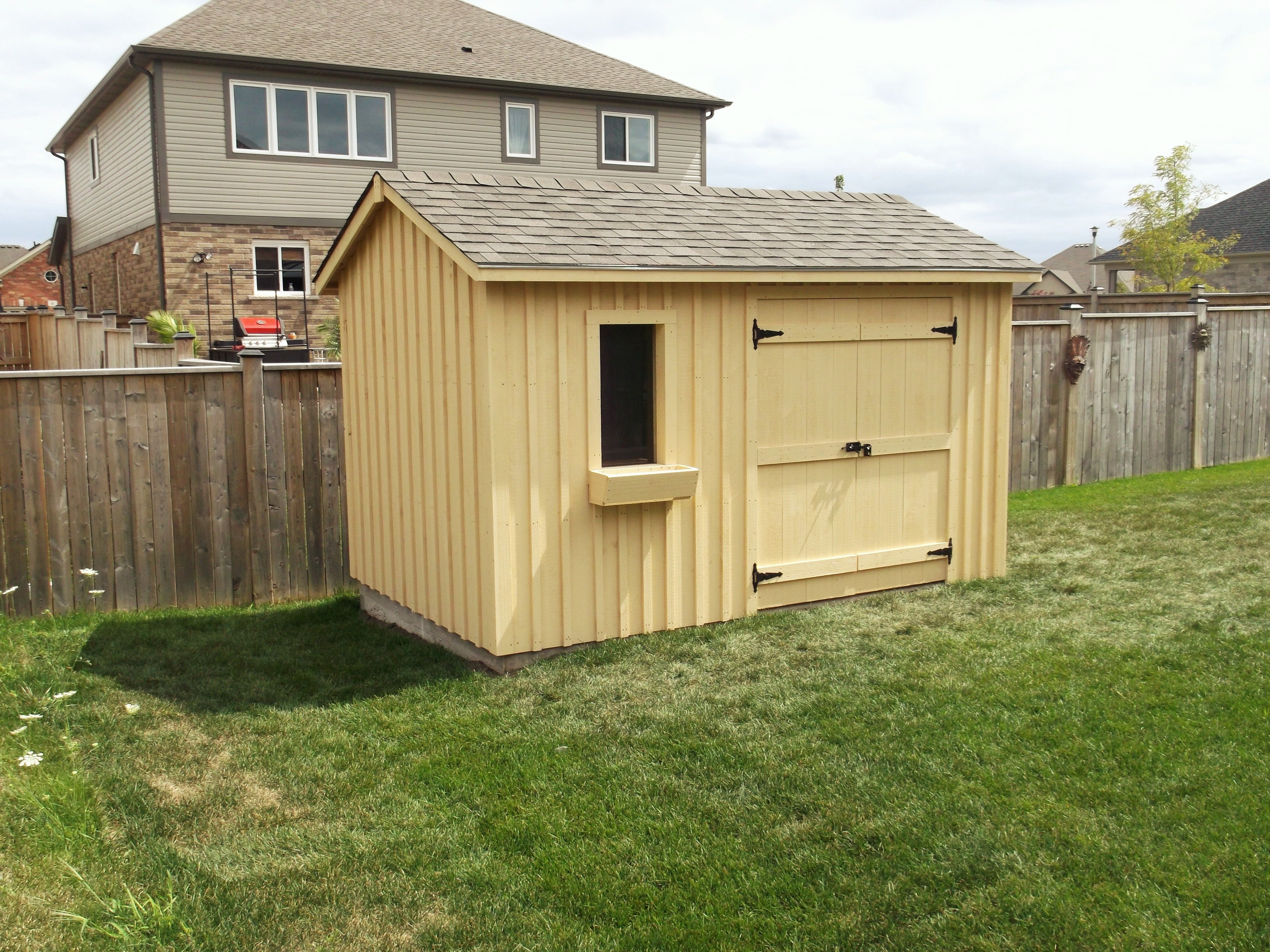 8x12 High Board and Batten. Two tone brown shingles with
