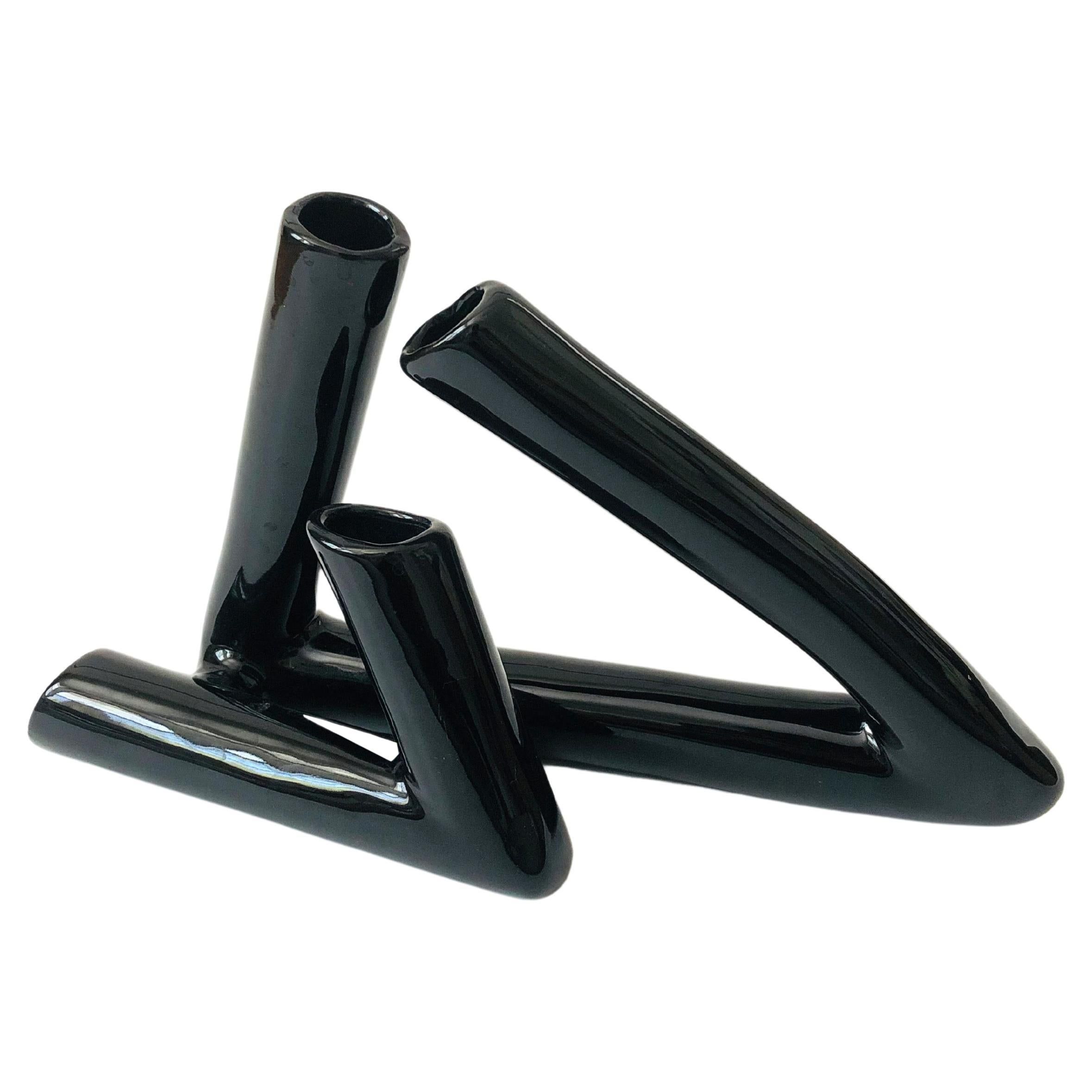 A vintage ceramic ikebana vase. Composed of hollow tubes that have been bent to create a sculptural composition. Finished in a glossy black glaze. Nice larger size to create a statement floral arrangement. Ikebana Vases, Modern Vase, Postmodernism, Tubular, Bent, Vintage Ceramic, Floral Arrangements, Hollow, Glaze