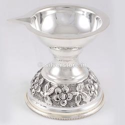 It can be used for any religious and auspicious occasion. The dark carving at the bottom of this Silver Diya complements its decency. Weight: 40 gm - 1 Diya Size: 2 inches Gold Pendant Jewelry, Antique Gold Jewelry, Antique Silver, Silver Jewelry, Nose Jewelry, Silver Anklets, Emerald Jewelry, Pendant Set, Gold Jewellery