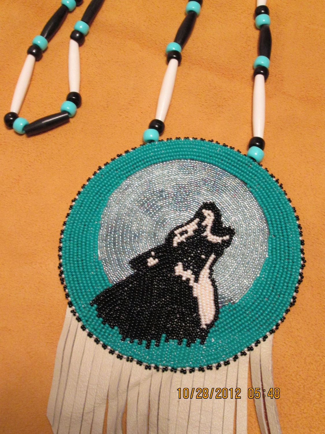 Beaded Wolf Medallion Black and Pearl. $79.99, via Etsy.