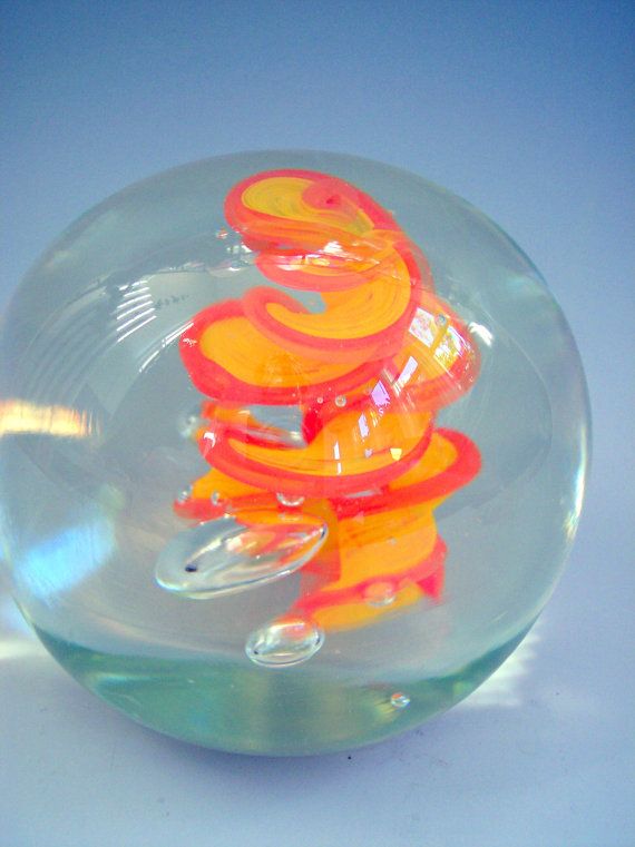 hand blown art glass paperweight in orange and yellow by riker art