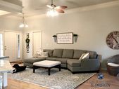 Sherwin Williams Agreeable Gray in living room with gray sectional couch and are... #sherwinwilliamsagreeablegray