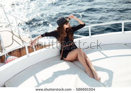 Image of young amazing brunette girl in sunglasses wearing hat sitting on the yacht Girl With Sunglasses, Brunette Girl, Yacht, Find Image, Photo Image, Royalty Free Stock Photos, Cover Up, Stock Images, Young