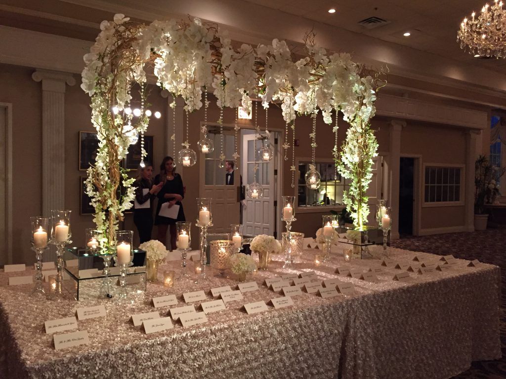 Place Card Table Designs Wedding Reception Pinterest Wedding Place Card Table With Submersible Fl Inside Gl Cylinders Large Gold Dragonwood Tree Dressed Hanging Crystal And Flowers