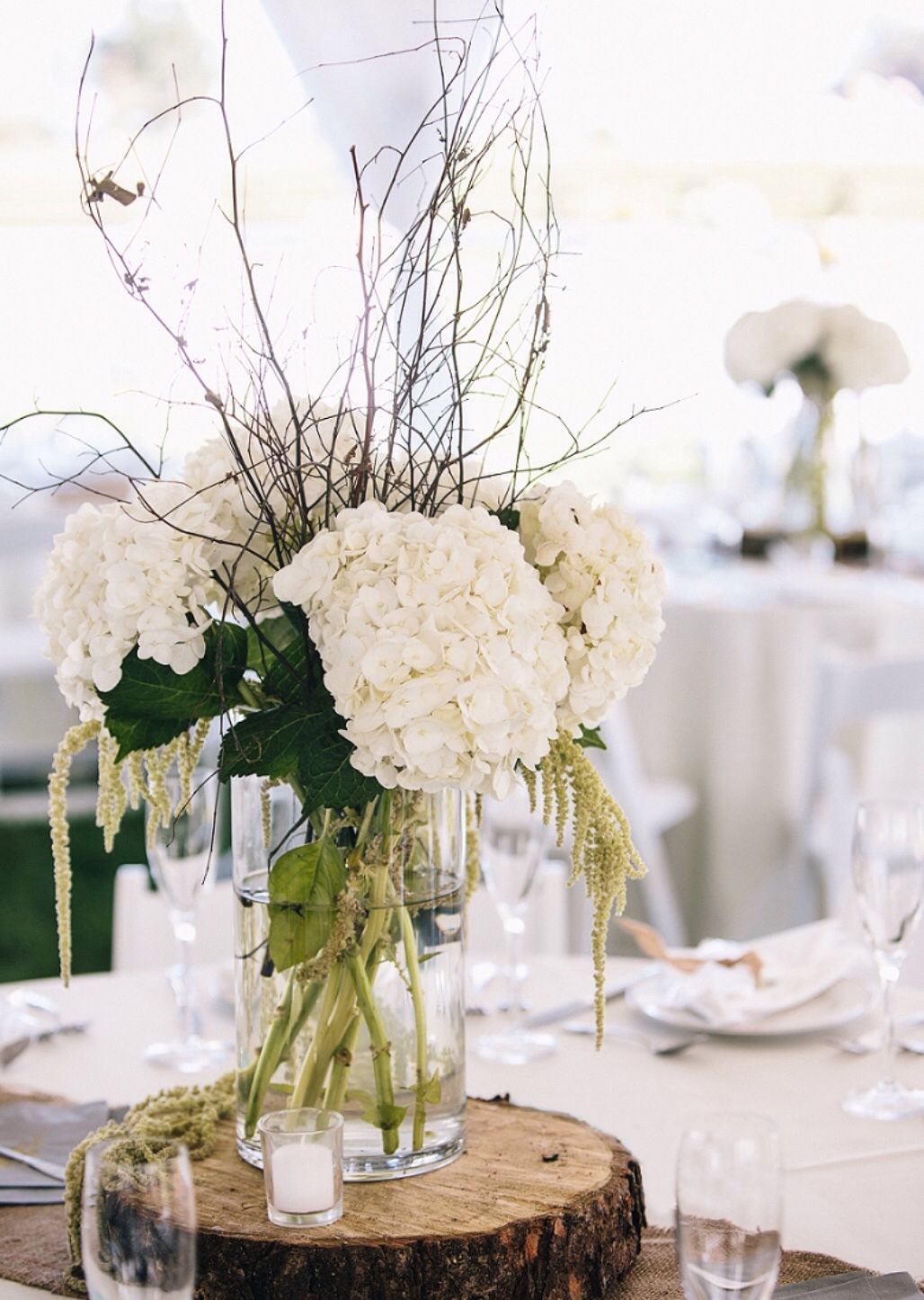 Hydrangeas With Sticks And Hanging Stuff On A Mirror With Candles