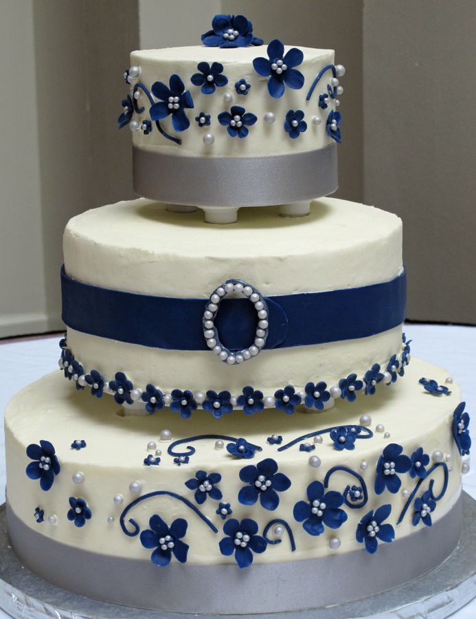 three tiers with two different types of cake white chocolate cream types of cake