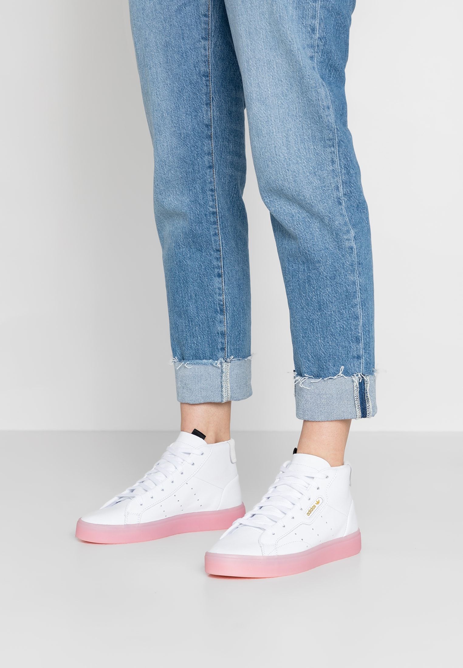 adidas originals sleek mid top sneaker in white and pink