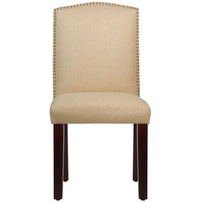 Wayfair Custom Upholstery™ An arched back is paired with elegant nailhead trim to round out this Nadia Upholstered Parsons Chair. Use it to add a refined look to the den or pull it up to the dining table to enjoy meals in stylish sophistication. Upholstery Color: Linen Sandstone, Leg Color: Espresso | Wayfair Custom Upholstery™ Nadia Upholstered Parsons Chair Upholstery Color: Linen Sandstone in Espresso/Linen Sandstone, Size 39"H X 20"W X 25"D Chair Upholstery, Chair Fabric, Custom Upholstery, Dining Chairs, Dining Table, Parsons Chairs, Nailhead Trim, Sandstone, Den
