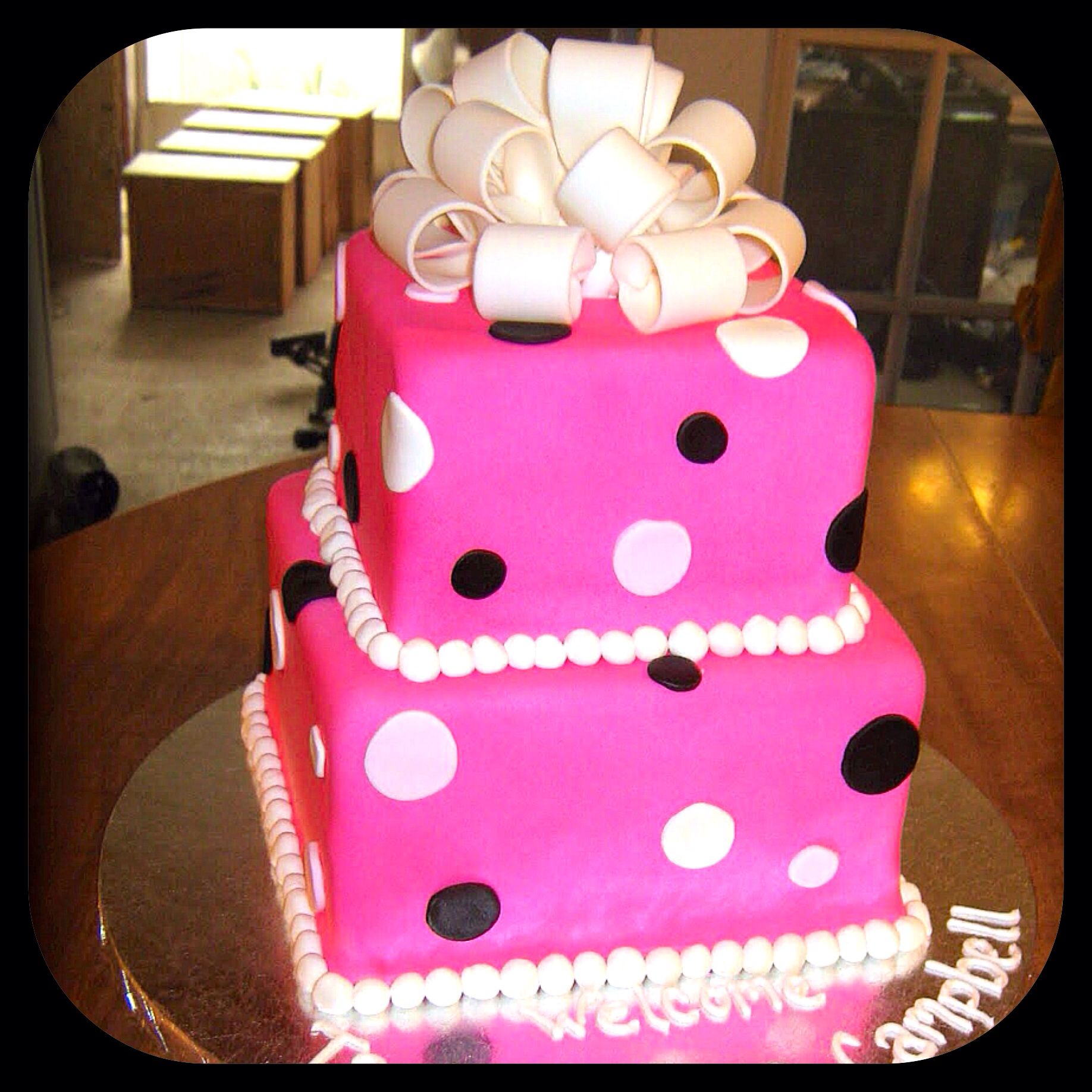 Square stacked fondant cake with polka dot design and bow ...