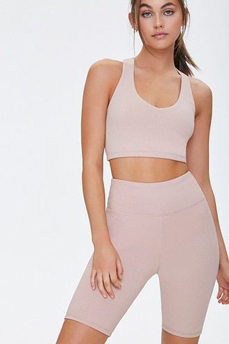 DetailsA pair of non-moisture-wicking, ribbed knit athletic biker shorts featuring an elasticized high-rise waist.Content + Care- 93% polyester