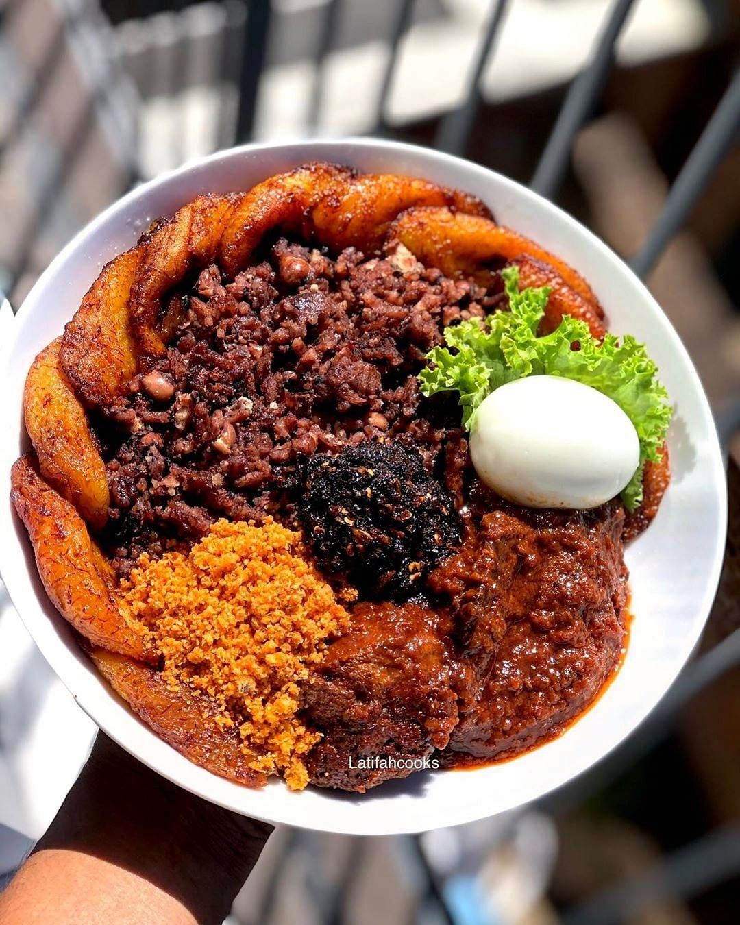 Waakye is a street food dish of rice and beans cooked in sorghum stock. It is usually eaten with a combination of gari(cassava grits), fried plantain, spicy chili sauces and a protein rich tomato stew. African Recipes Nigerian Food, West African Food, African Cooking, Nigeria Food, Ghana Food, Food O, Good Food, Yummy Food, Recipes