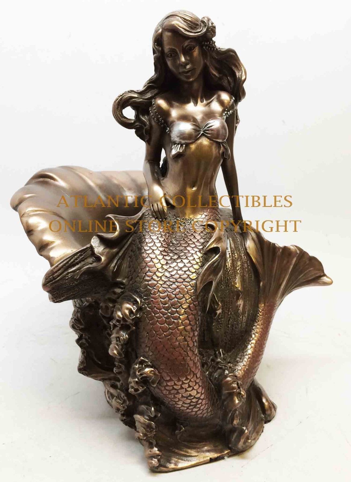 bronze mermaid figurine